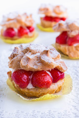 Cream Puffs with strawberries, selective focus