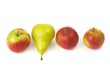 Pear among red apples isolated on white background