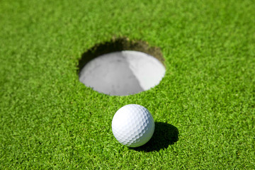 Golf ball close to the hole