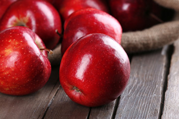 Ripe red apples on table close up