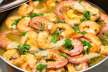 Shrimp cooking with parsley