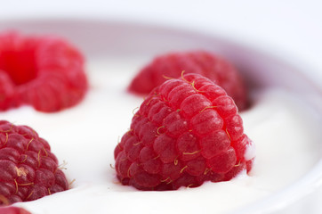 Natural yogurt with fresh raspberries