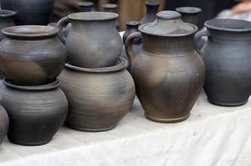 Products made of red clay. Pottery of different sizes exhibited