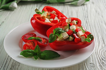 Fresh green salad in pepper on table close up