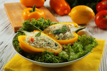 Stuffed peppers with vegetables on table close up