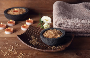 Beautiful spa composition with candles on wooden background