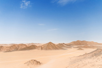Fototapeta na wymiar Desert Landscape of Egypt. Yellow sand, mountains, clouds.