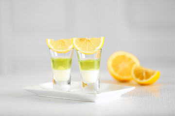 Shot glass with jelly on light background