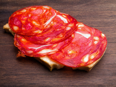 Breas with slices of chorizo, pepper sausage