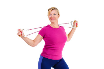 Happy and smile old senior blond woman dressed in shirt color Marsala doing fitness exercises with expander a resistance band, isolated on white background, Positive human emotions