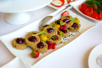 Chicken liver pate with jam on the white plate