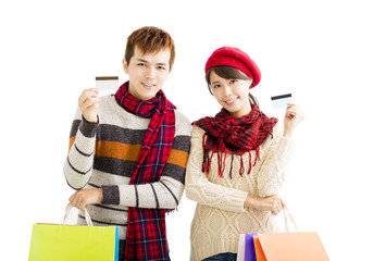 young couple with shopping bags and credit card