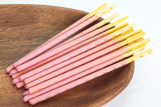 Japanese snack food biscuit stick strawburry coated on white background.