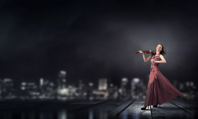 Obraz premium Woman play violin