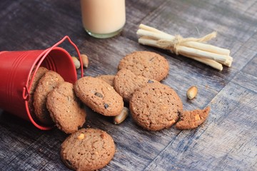 Tasty chocolate chip cookie and sour milk