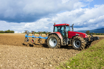 tractor plowing a field