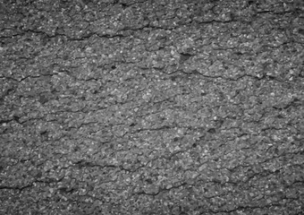 Asphalt background broken texture with some fine grain in it of