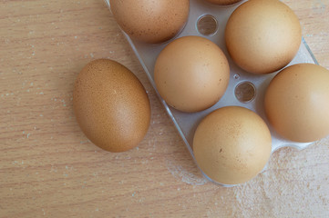 Chicken egg on wood and chicken egg in panel eggs on wood backgr