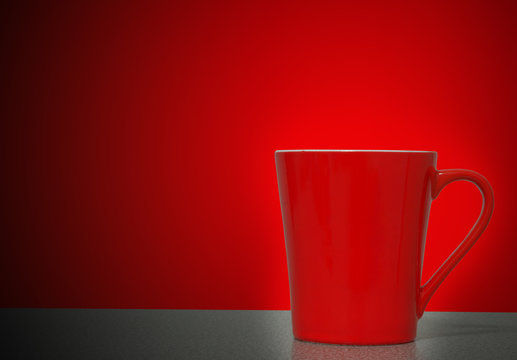 Red cup on wooden table red background