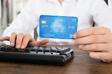Businesswoman With Computer Keyboard And Credit Card