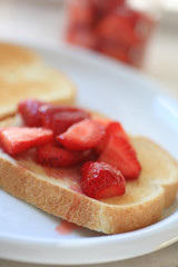 Toast with macerated (sweetened) strawberries closeup