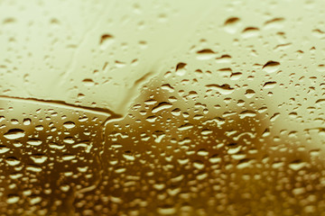 Natural water drops on glass