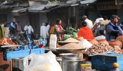 Indian colored spices at local market. Small shops like this are the most common in poor region of...