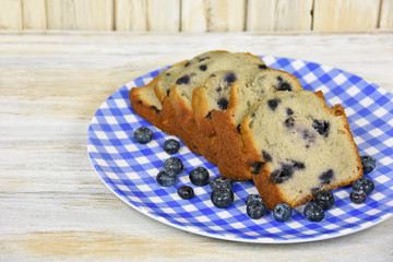 blueberry bread and blueberries on checkered plate