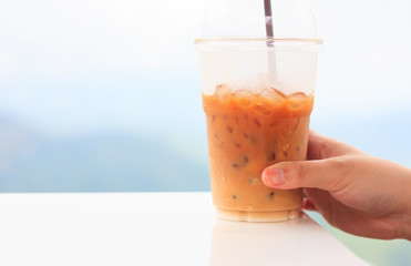 woman's hand hold ice coffee cup