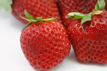 Red juicy wet strawberries closeup