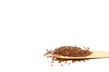 wooden spoon of flax seeds isolated on white