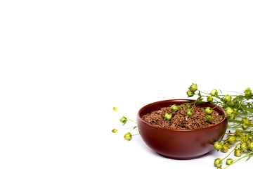 isolated bowl with flax seeds and dry flax plant capsules