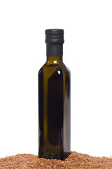 Flax oil and flax seeds isolated on white background