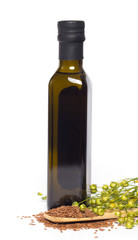 Flax oil and flax seeds isolated on white background