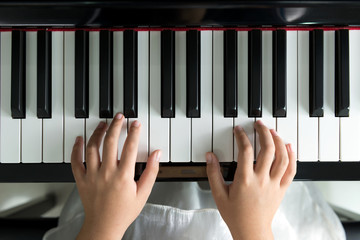 Little girl playing piano