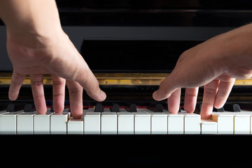 Musician hands on piano