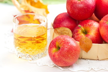 Apple juice and red apples