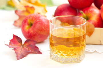 Apple juice and red apples