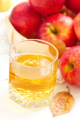 Apple juice and red apples