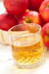 Apple juice and red apples