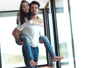 happy young romantic couple have fun and  relax at home indoors