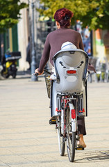 Woman with bicycle in the city © majorosl66