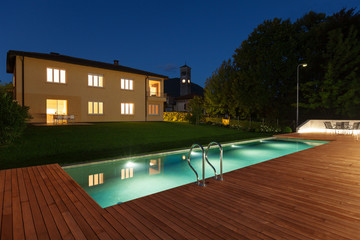 Modern swimming pool, wooden floor