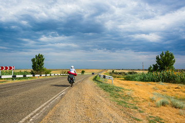 The Bicycle rider on the road.