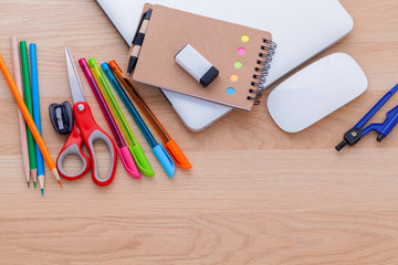 Back to school concept with school supplies laptop ,book, pen,mo