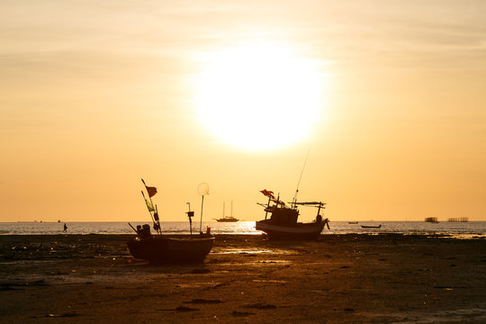 Sunset and siluate boat