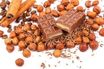 Chocolate, nuts and cinnamon sticks.