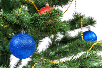Christmas tree decorated with blue and red balls