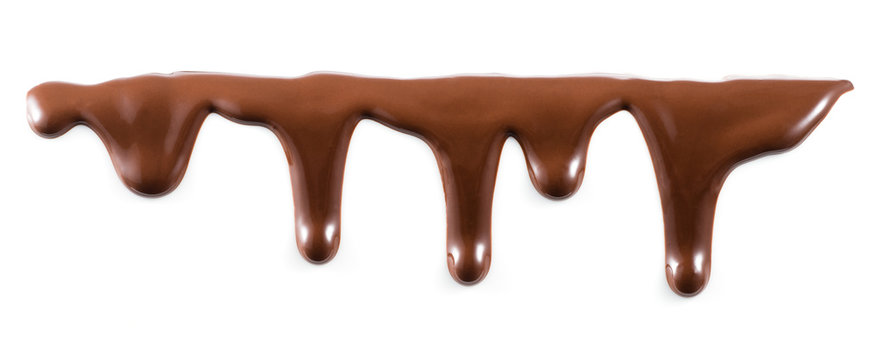 Melted chocolate is dripping. Streams isolated on white.