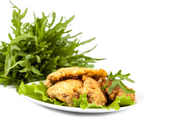 Steaks and lettuce on a white background.